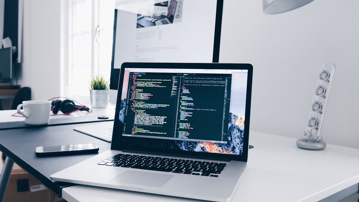 Code being written on a laptop